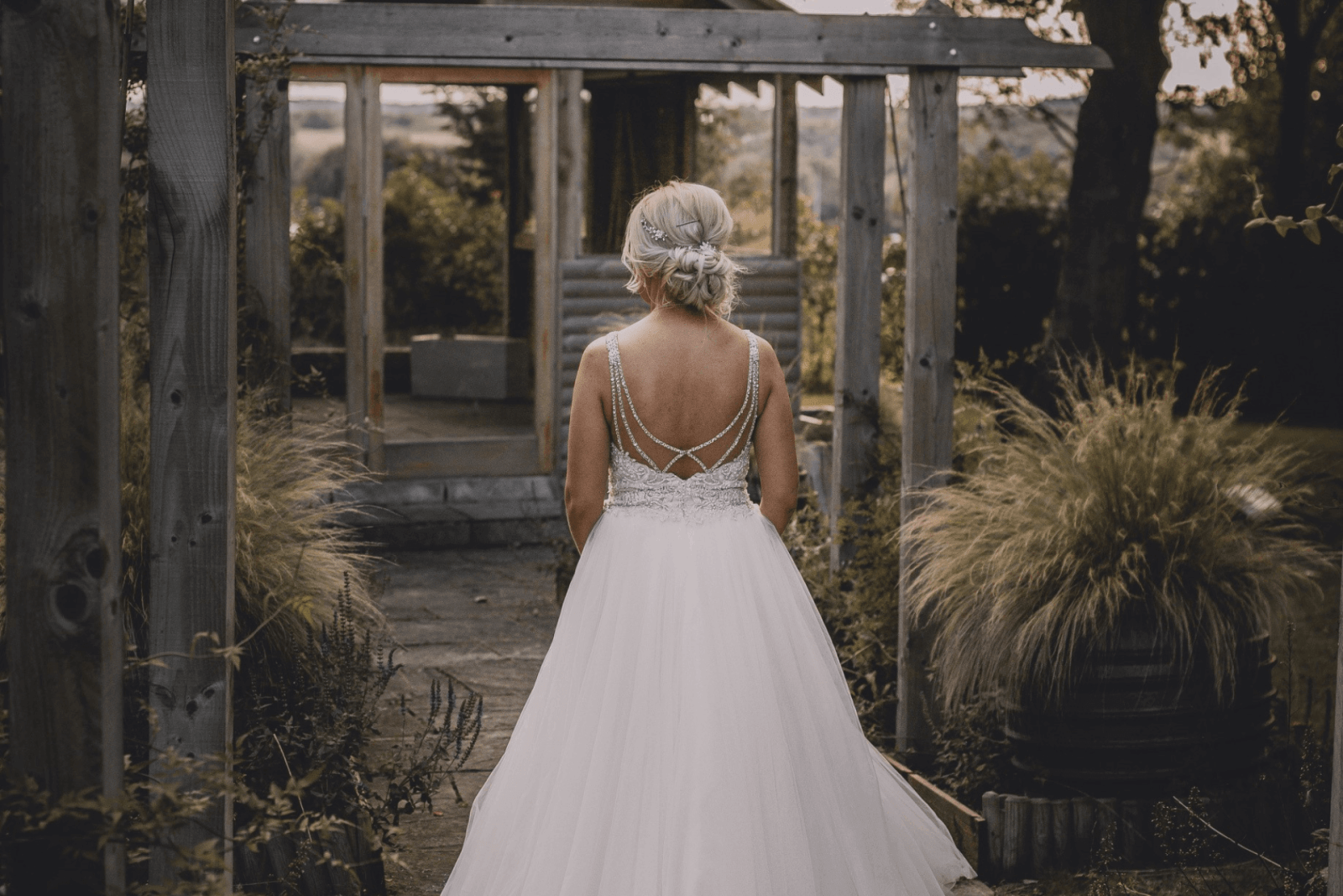 Bride in white dress walking away