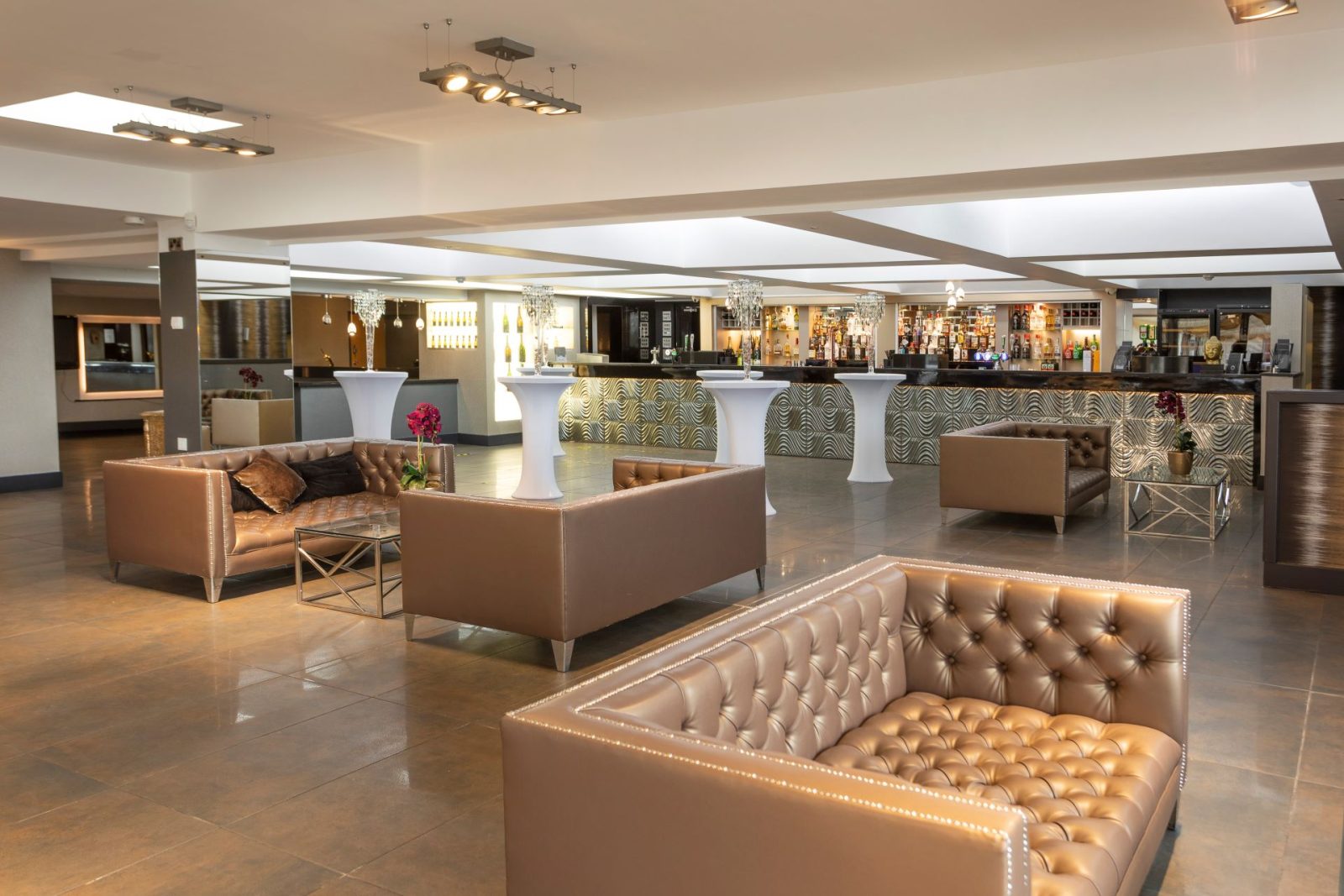 Modern corporate hospitality venue with stylish furniture and well-lit interior