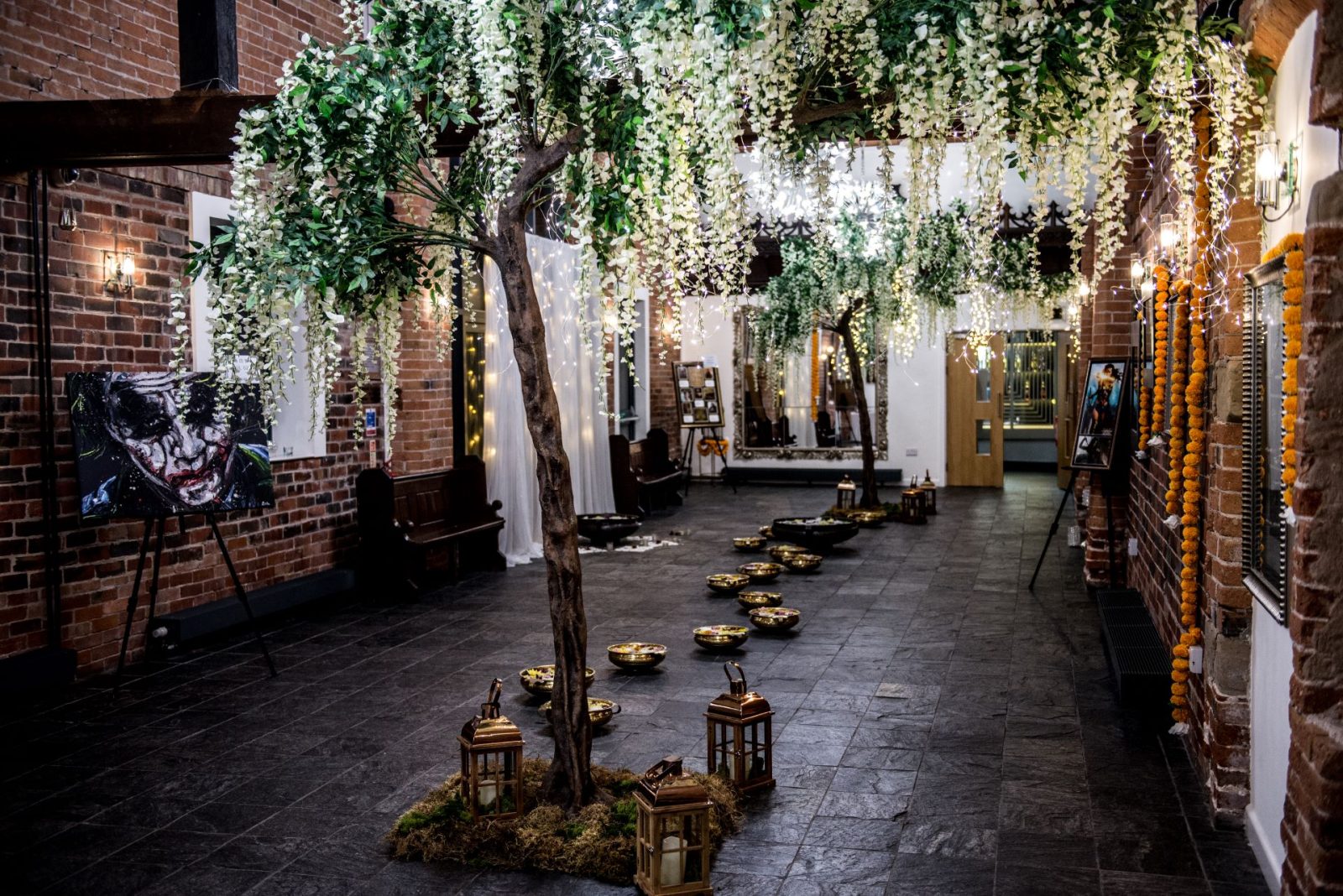 Event hall with beautiful floral decorations and traditional lighting