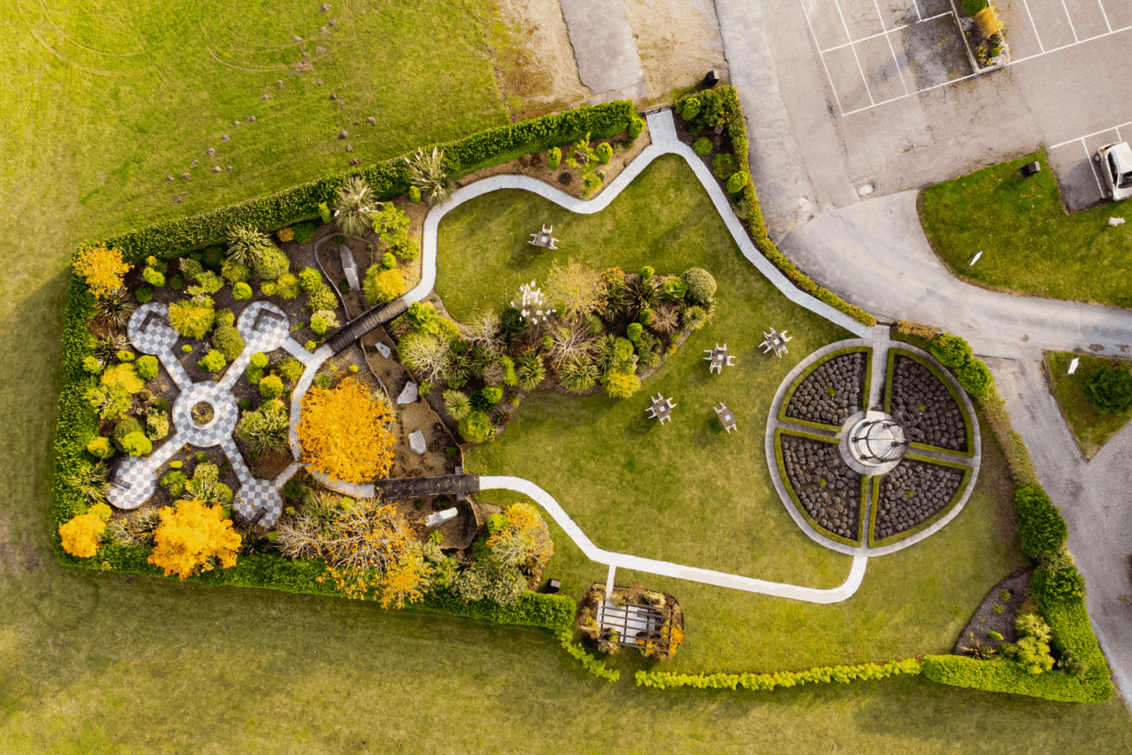 Aerial view of a landscaped garden with pathways and greenery