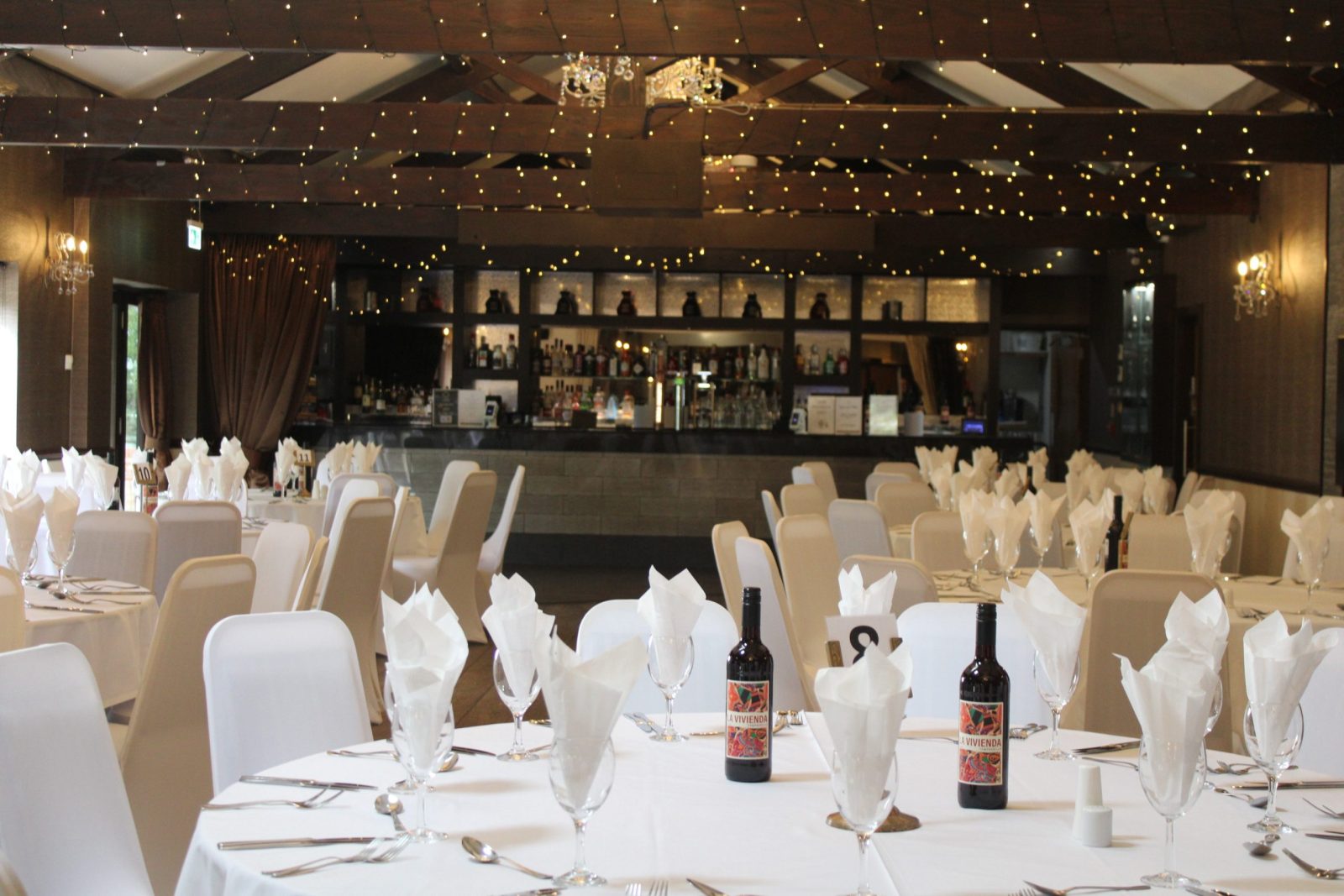 Elegant dining room with tables set for a formal event